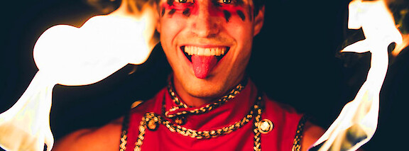 festival themed fire performer