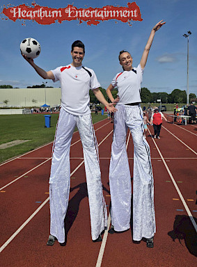 hire football stilt walkers